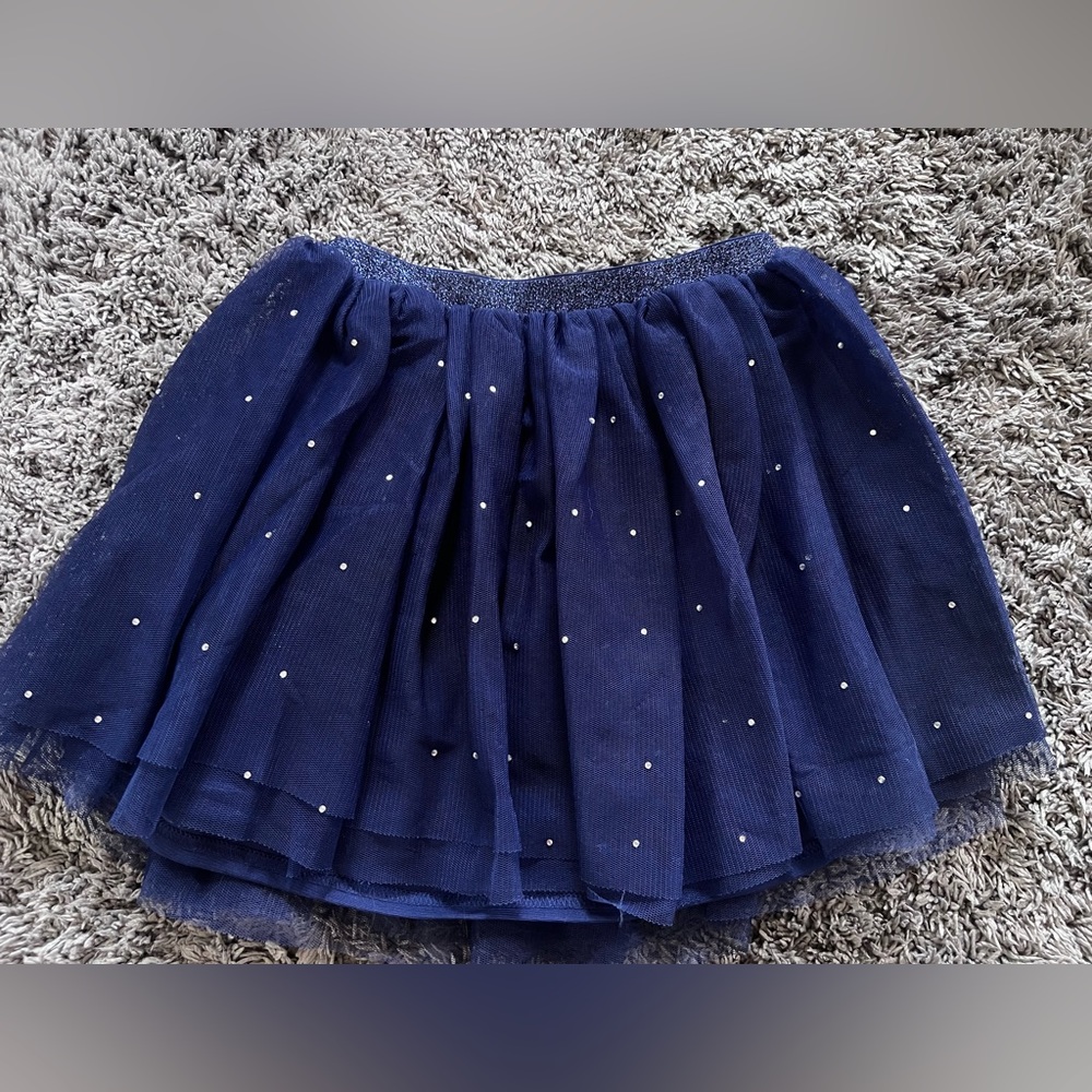 Gorgeous navy tulle skirt with sparkly gems & sparkly elastic waistband. Size 6